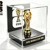A clear acrylic display box featuring a gold FIFA World Cup trophy figurine.