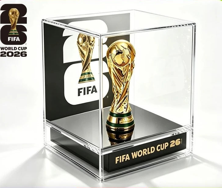 A clear acrylic display box featuring a gold FIFA World Cup trophy figurine.