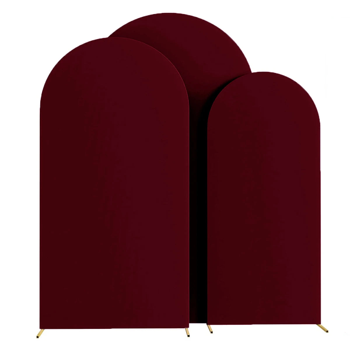 A set of three deep burgundy fabric arch stands used as a backdrop for wedding and event decor.