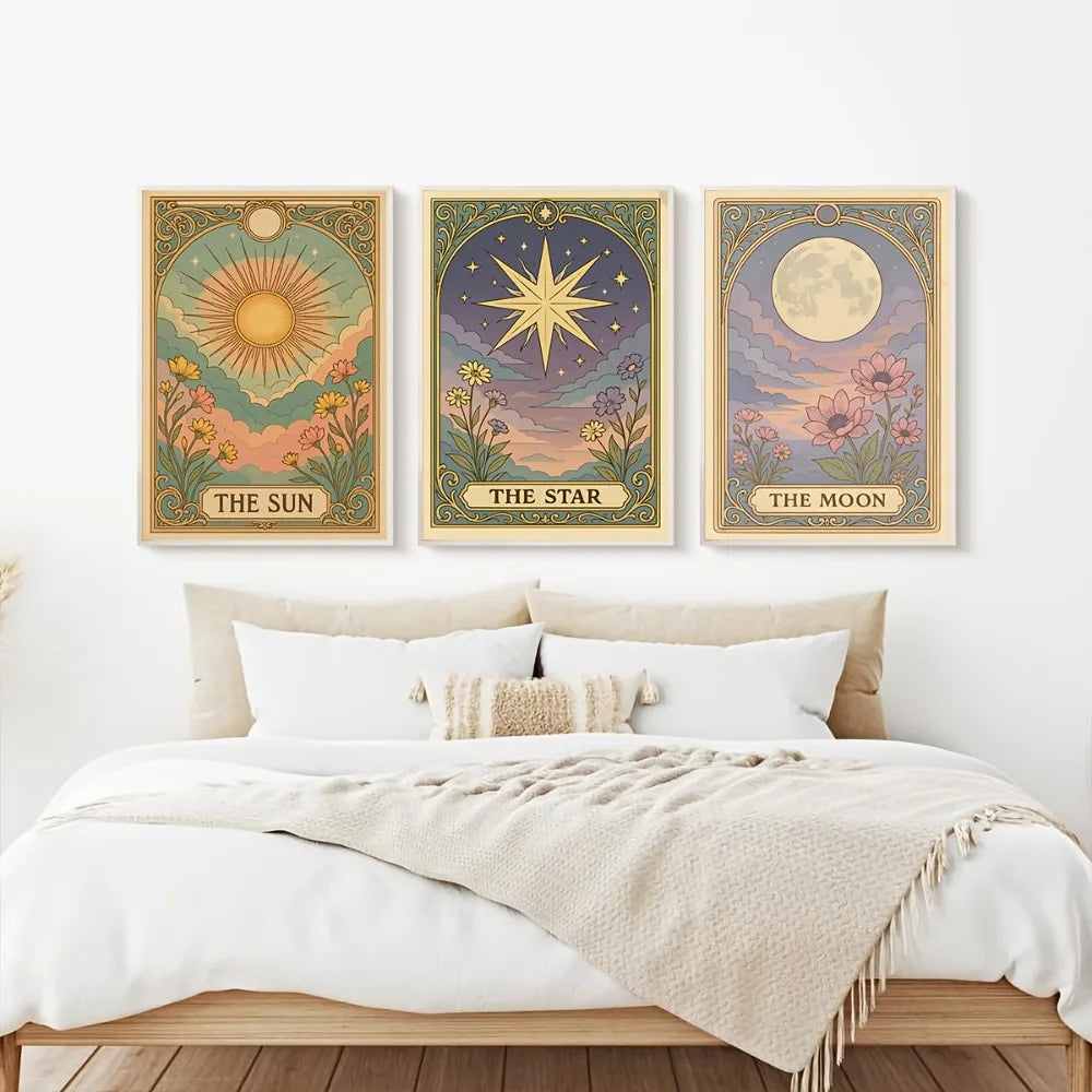 A set of three framed celestial wall art prints featuring the sun, a star, and the moon on a muted background.