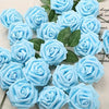A cluster of light blue artificial rose flowers with green leaves arranged for DIY decor.