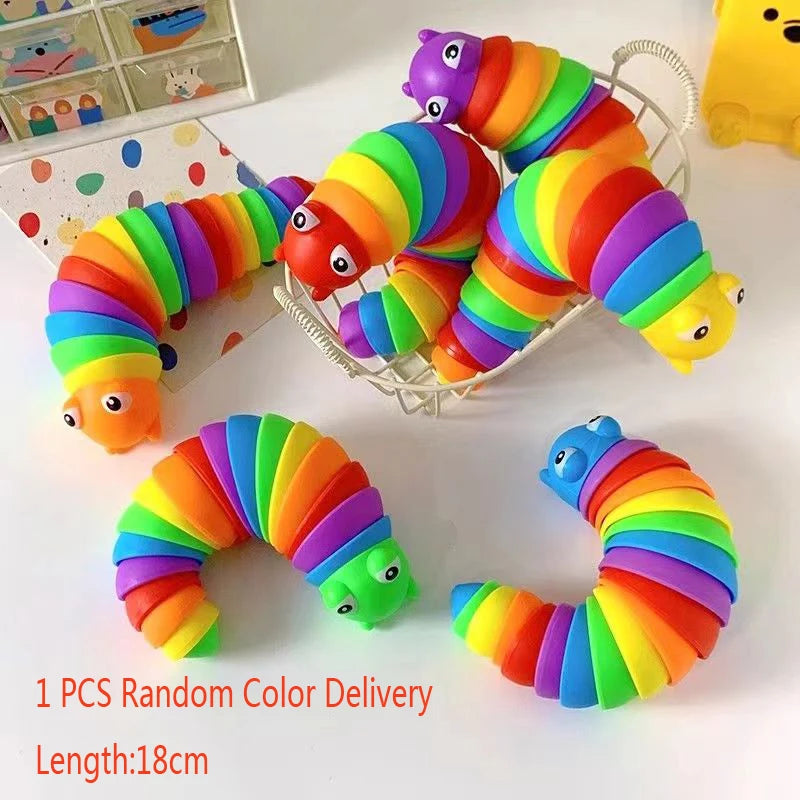 One piece of a colorful, flexible, striped fidget slug toy with bright rainbow colors.