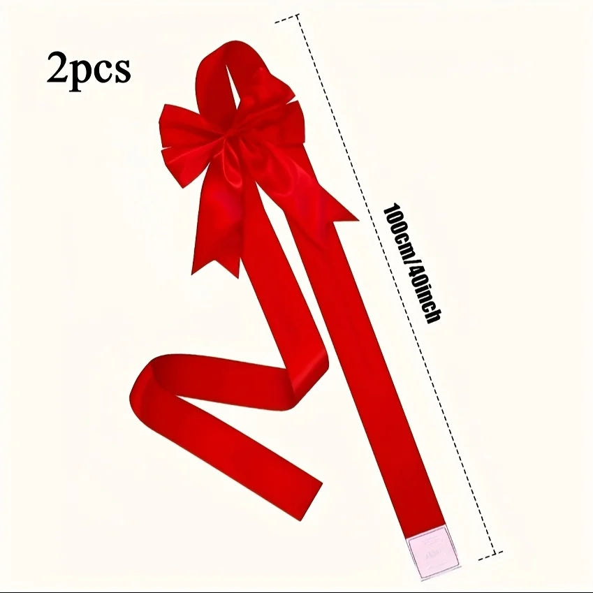 Two red satin ribbon bows shown vertically, measuring 100cm/40inch long.
