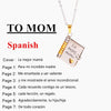 A silver pendant necklace featuring an openable book design with engraved Spanish text for a mother.