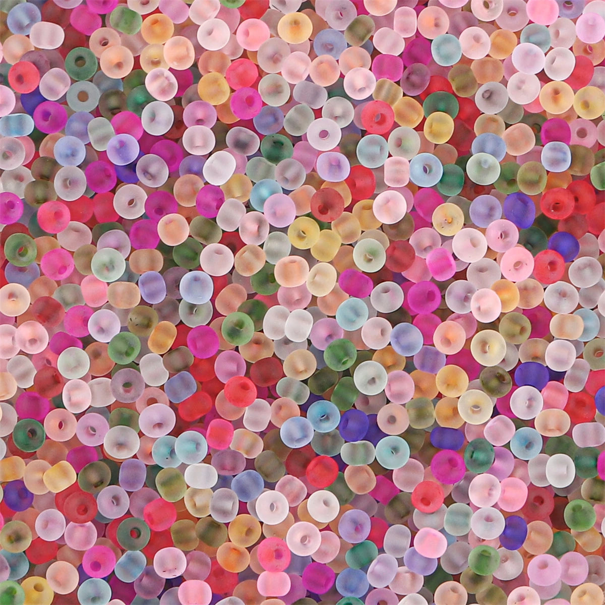 A close-up view of numerous small, round frosted glass rice beads in various shades of pink, green, yellow, and blue.