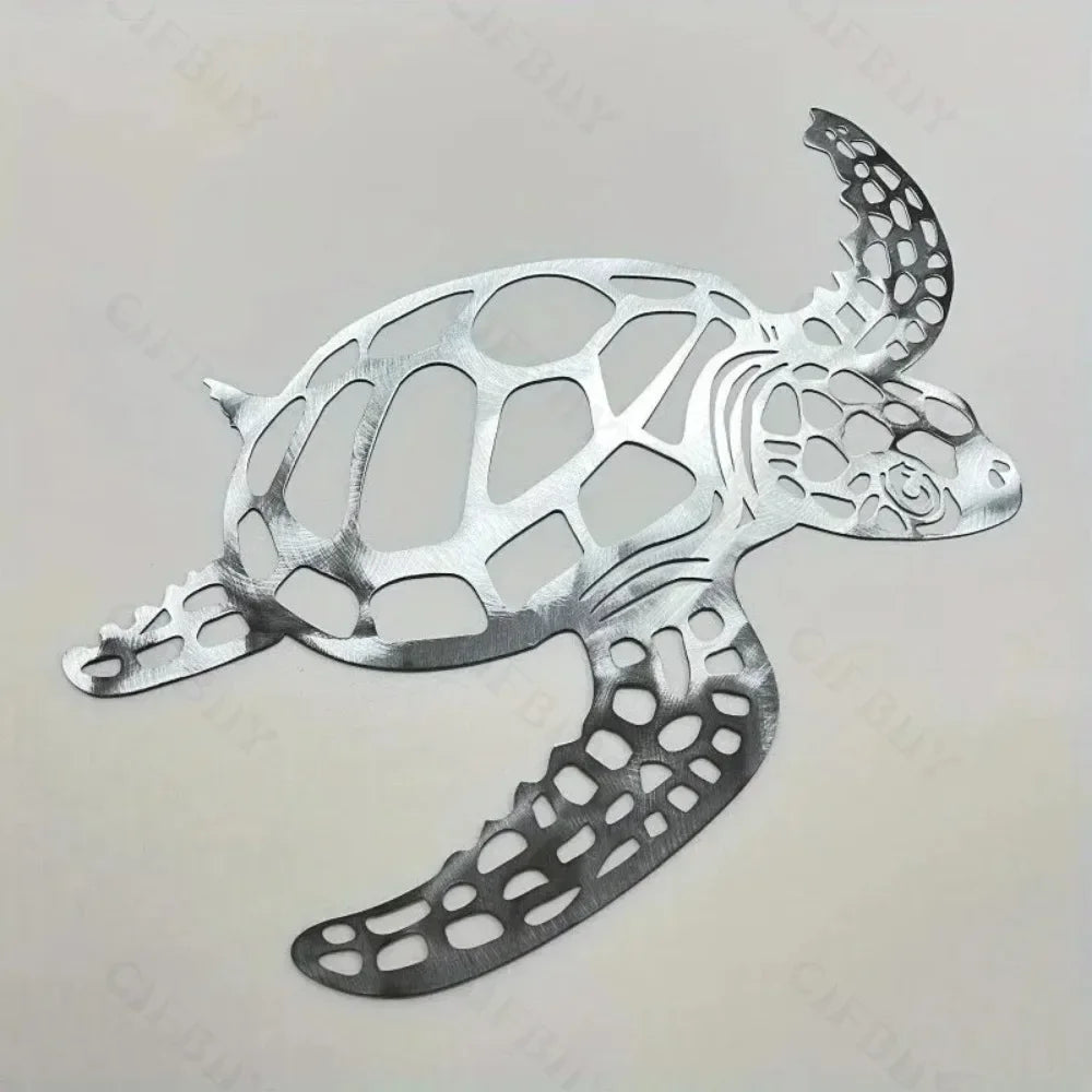 Silver metal sea turtle wall art featuring intricate cutout design for coastal beach decor