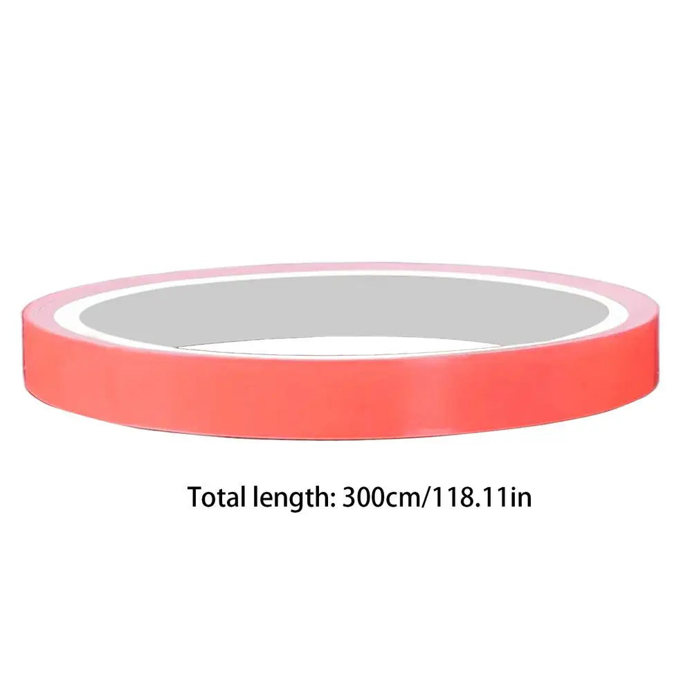 A roll of glow-in-the-dark safety warning tape in orange color.