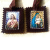 A dark brown wool scapular featuring a framed image of the Sacred Heart and a depiction of Mary holding the infant Jesus.