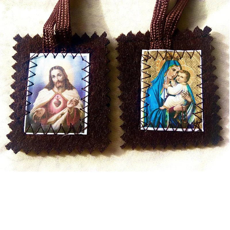 A dark brown wool scapular featuring a framed image of the Sacred Heart and a depiction of Mary holding the infant Jesus.