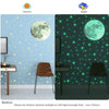 Wall decals showing a daytime scene with a moon and stars, and a night scene with glowing green stars and a large moon.