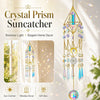 A hanging crystal prism suncatcher with a gold geometric frame featuring colorful glass prisms and dangling beads.