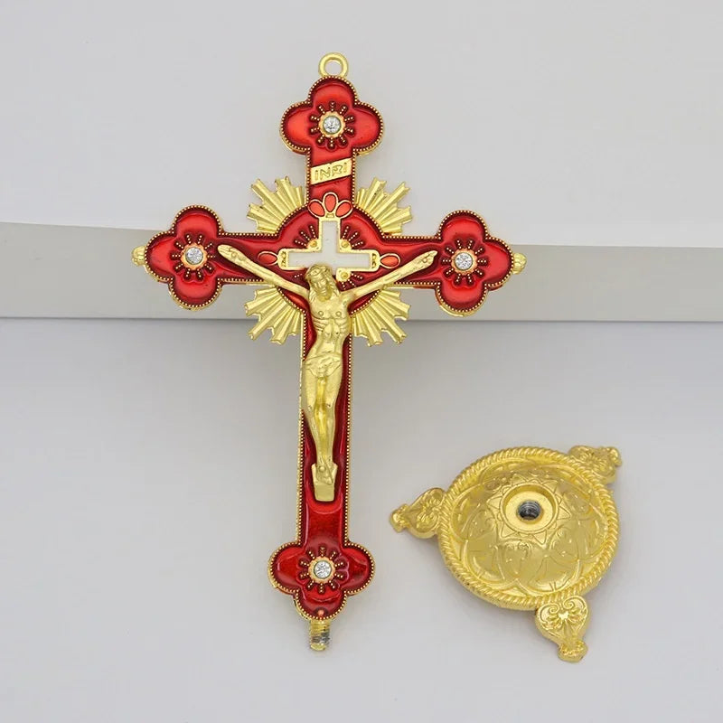 Antique-style crucifix figurine featuring a gold-toned cross with a corpus and a decorative stand.