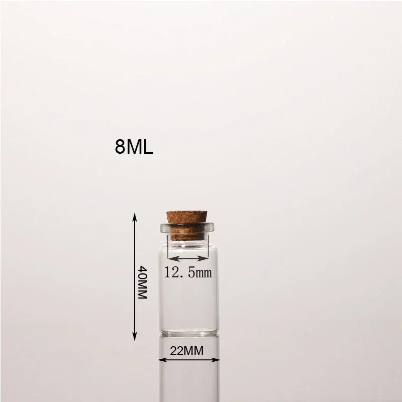 A clear glass bottle with a cork stopper and a measuring scale indicating 8ML volume.