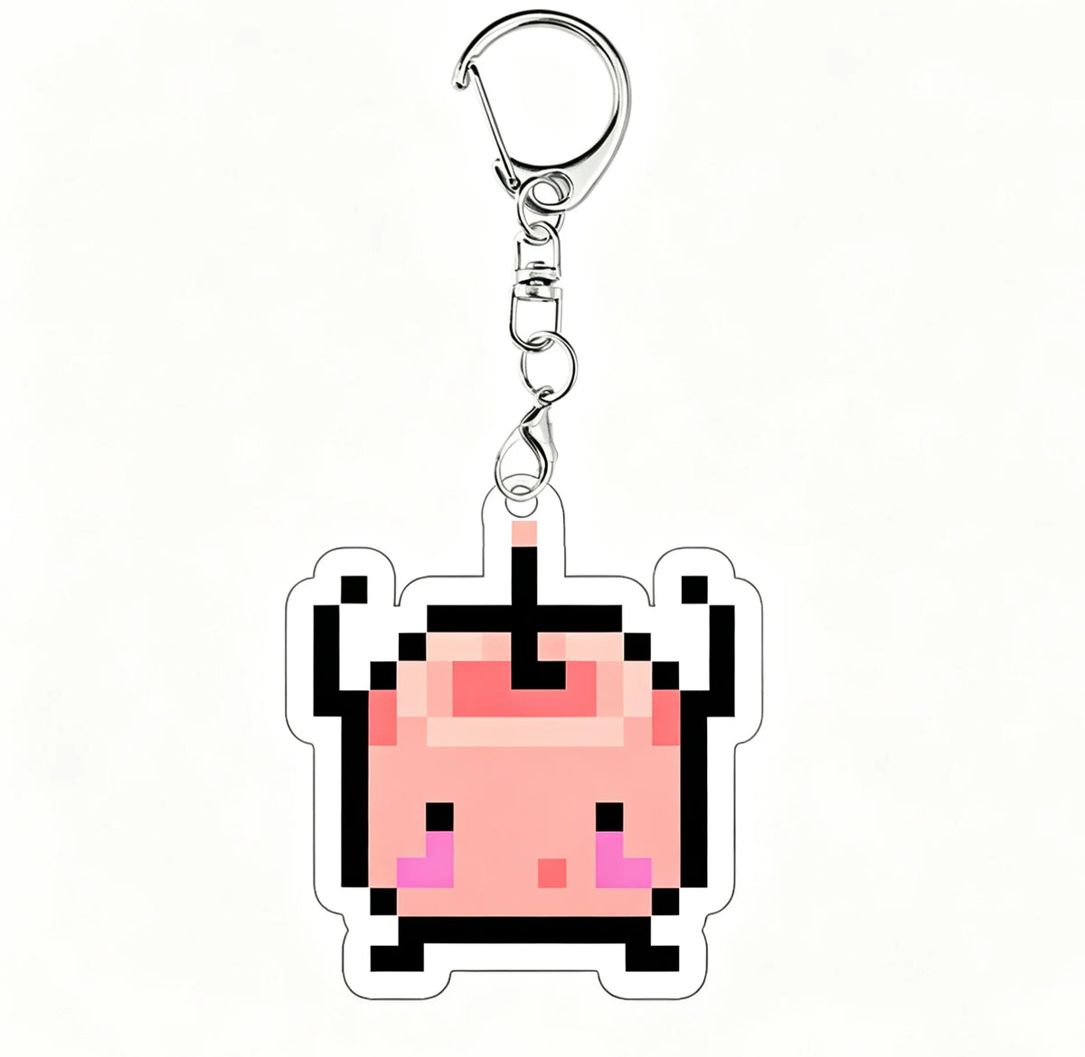 A pink pixel art charm of a character from Stardew Valley on a clear acrylic keychain.