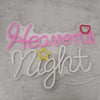 Pink and white neon sign spelling out Heavens Night on a fuzzy gray surface.