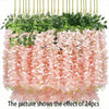 A dense arrangement of pink and green artificial wisteria flowers used as floral decor.