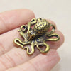 Antique brass octopus desk ornament with detailed texture and curled tentacles