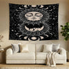 A black and white decorative banner featuring a stylized sun and moon face surrounded by intricate astrological patterns.