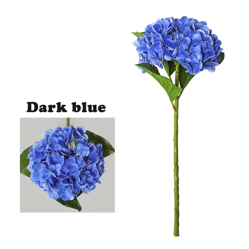 A cluster of dark blue hydrangea flowers on a green stem.