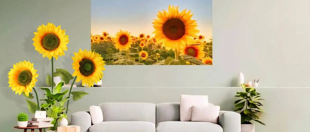 A vibrant painting of a field of sunflowers displayed above a modern sofa.