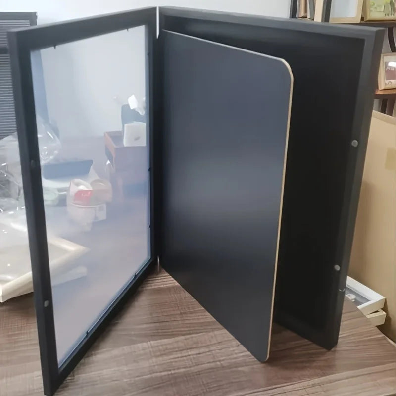 A dark gray wall-mounted wooden jersey display frame shown open, displaying a smooth interior panel.
