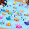 A collection of colorful mini resin axolotl figurines in various shades and poses for fairy gardens or terrariums.