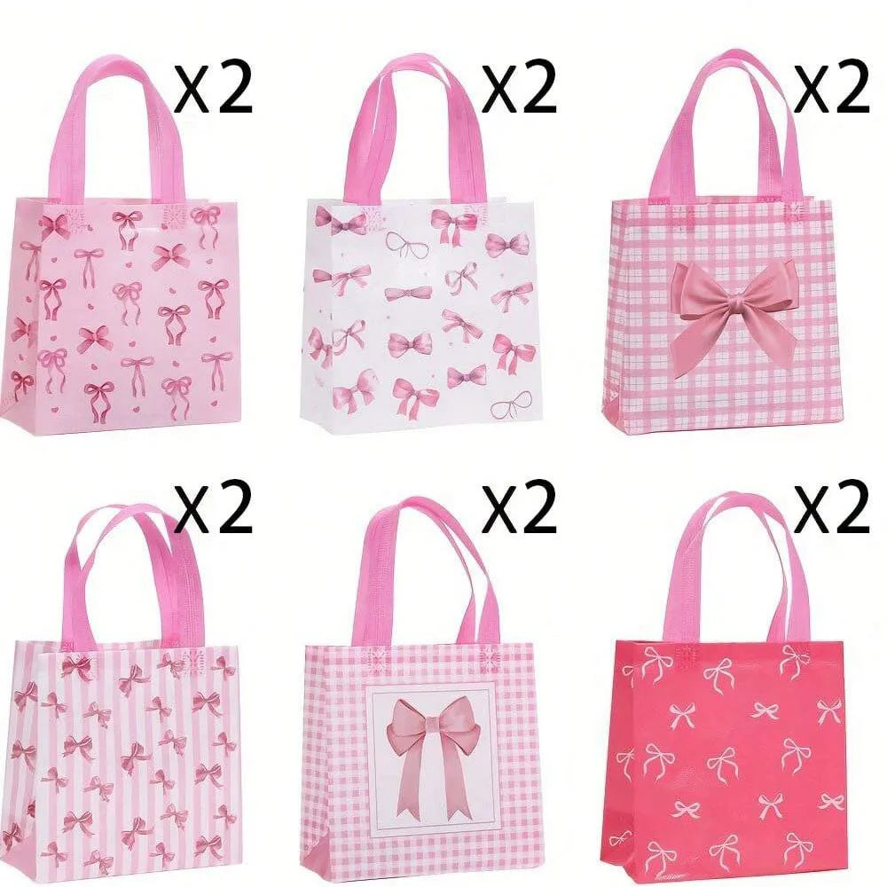 Set of pink and white gift bags featuring various bow and heart cutouts