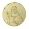 A gold-plated commemorative coin depicting Jesus Christ with radiating light.