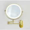 A round, illuminated makeup mirror with a gold-toned mounting bracket and USB charging feature.