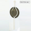 A handmade macrame hat organizer with a wooden dowel is shown as a single layer boho wall hanging.