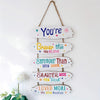 Rustic wooden inspirational hanging sign featuring text encouraging self-belief and strength.