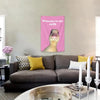 A pink tapestry featuring a yellow duck welcoming viewers to its crib hanging on a wall.