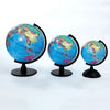 Three desktop educational globes showing the Earth's surface from different angles.