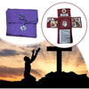 A purple handcrafted pocket shrine featuring a cross and religious imagery set against a sunset background.