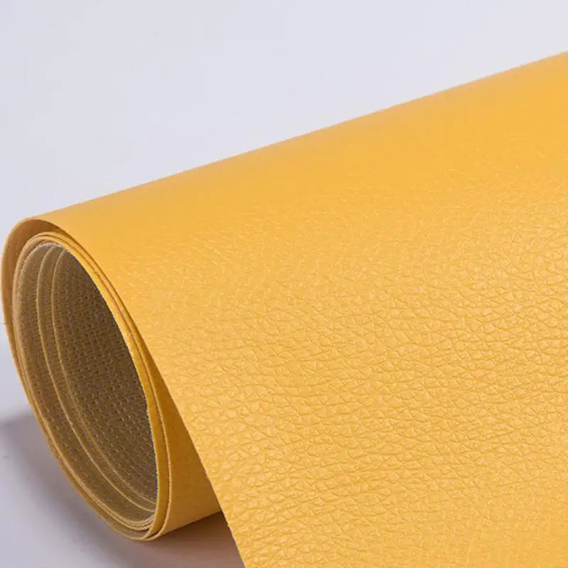 A roll of yellow self-adhesive PU leather repair patches.