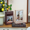 A set of three books featuring modern interior design and space concepts displayed on a wooden surface.