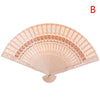 A delicate, light beige lace folding hand fan with intricate patterns.