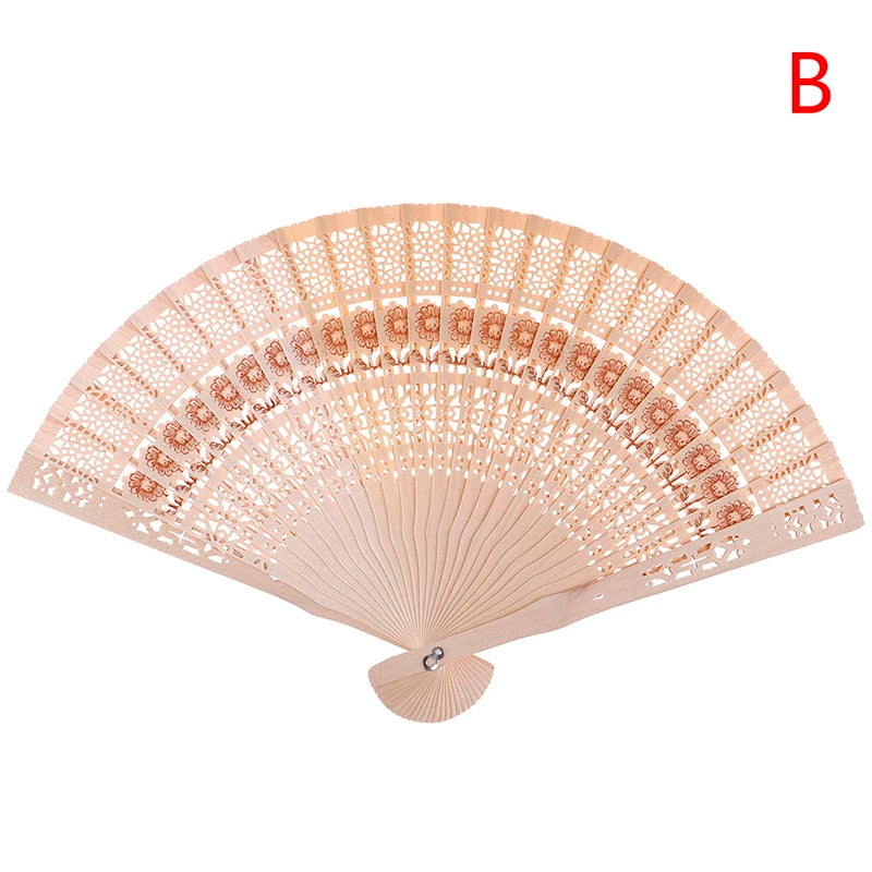 A delicate, light beige lace folding hand fan with intricate patterns.