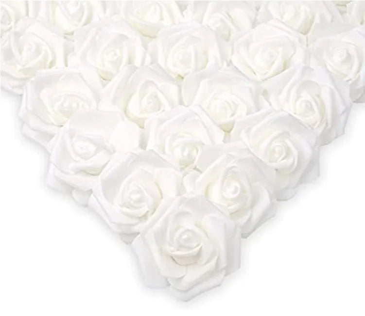 A heart shape made of white artificial foam roses.