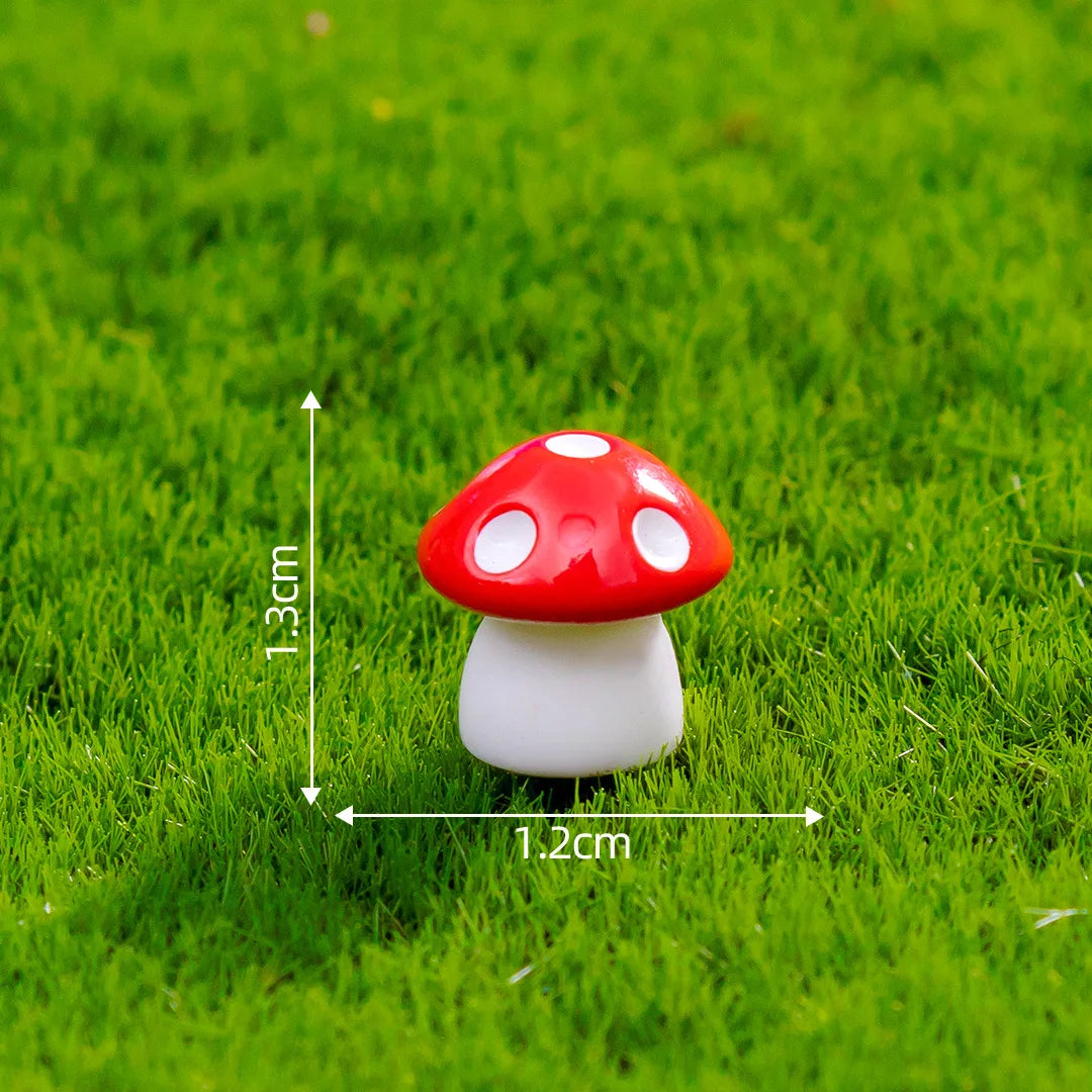 A small red and white resin mini mushroom figurine set placed on green grass.