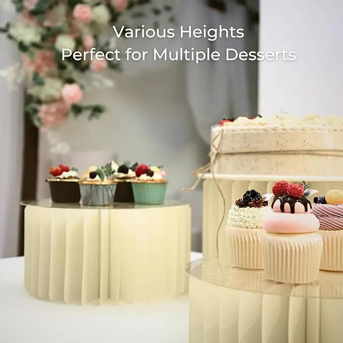 A tiered folding dessert table display featuring various heights of cupcakes and desserts.