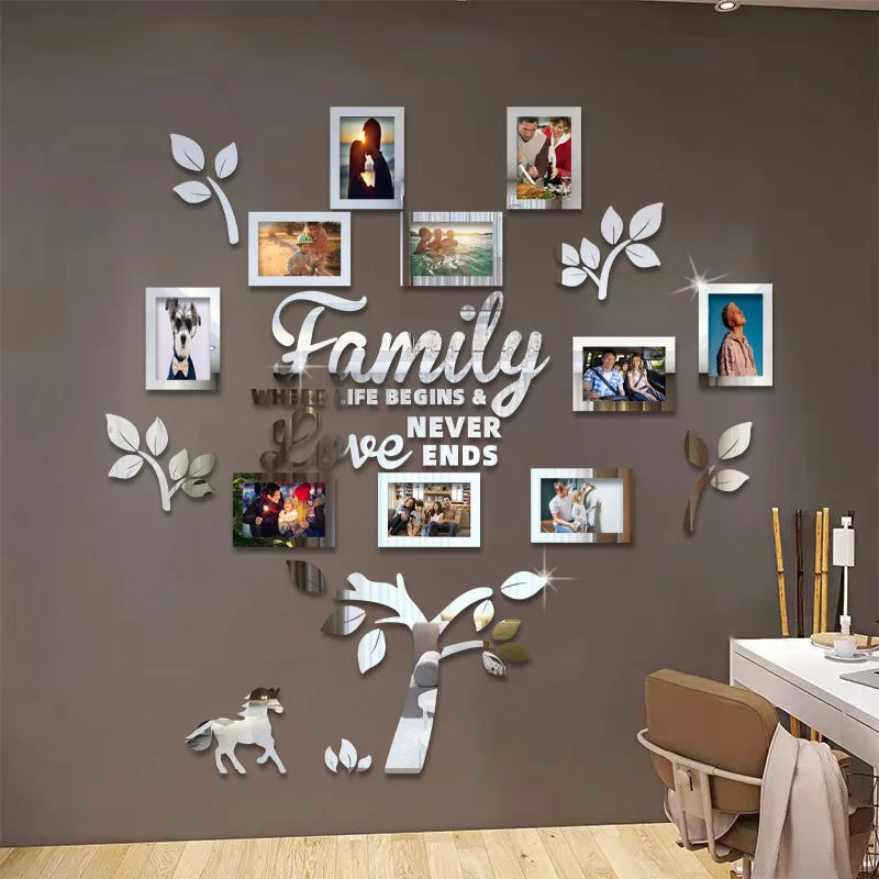 A wall collage featuring various framed photos and decorative leaves arranged in the shape of a family tree.