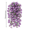 A hanging vine of purple pansy flowers and green eucalyptus leaves