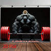 A muscular gorilla is shown lifting a barbell in a black and white studio setting for a weightlifting backdrop banner.