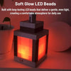 A square LED bead lantern night light with an orange glow sitting on a surface.