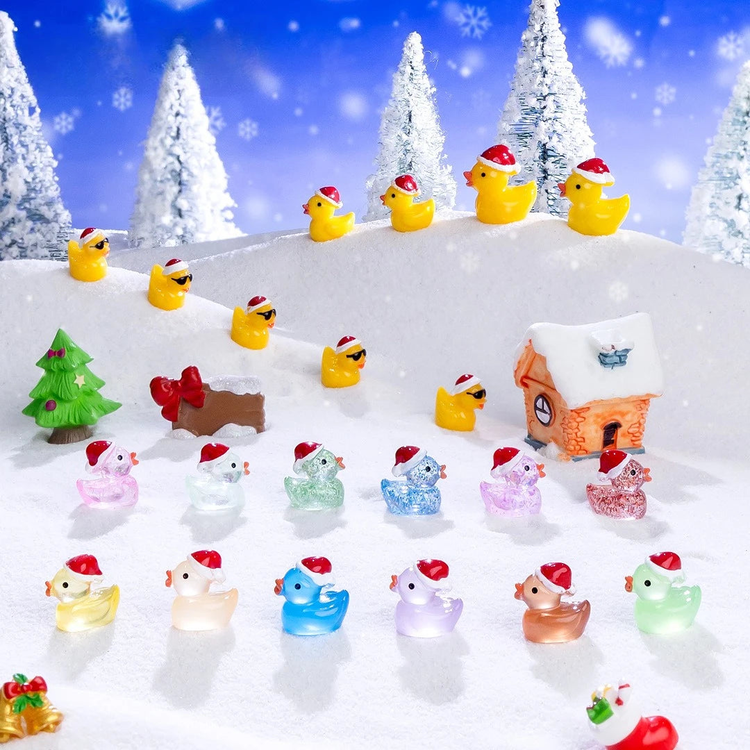 A collection of glow-in-the-dark duck figurines wearing Santa hats displayed on a snowy surface.