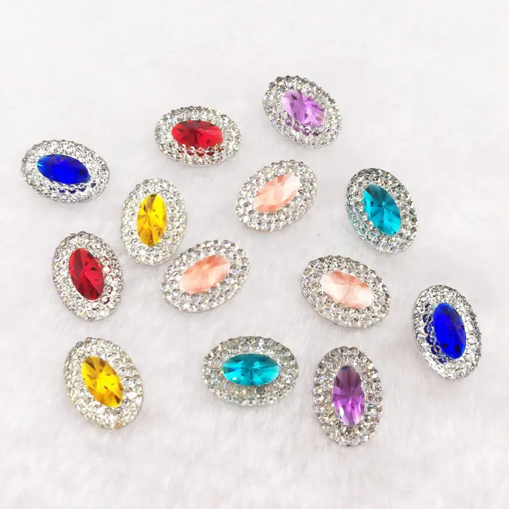 A collection of colorful gemstone flatback rhinestones in various colors like red, blue, green, yellow, and purple.