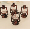 Three vintage ceramic miniature lanterns with glass bulbs and metal frames for dollhouse décor
