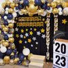 A balloon garland arch featuring navy blue and gold balloons decorating a dark backdrop for an event.