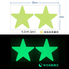 Two neon green star-shaped glow-in-the-dark wall stickers shown in daylight and nighttime settings.
